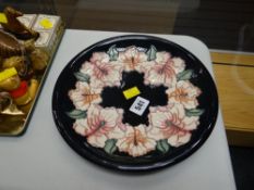 A Moorcroft blue ground floral dish dated 1999