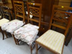 A set of three inlaid mahogany drawing room chairs