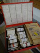 A box of cigarette cards, mainly loose