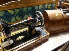 A vintage Singer sewing machine in case