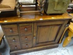 A reproduction hardwood apothecary-style chest with single cupboard combination