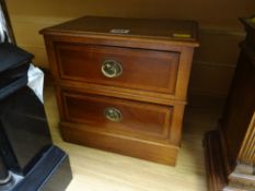 A two-drawer table top chest