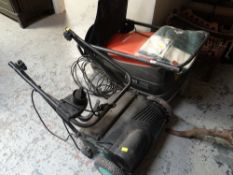 A Flymo Turbo Compact lawn mower together with a lawn spiker