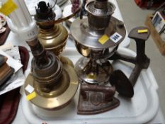 Two pottery face masks, three oil lamps, a cast iron boot remover, shoe last etc