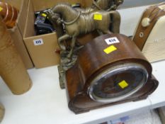 A polished mantel clock & a pair of brass horses