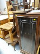 A narrow single-door glazed bookcase, an Ercol spindle back chair & a coffee table etc