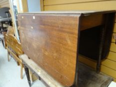 A nineteenth century drop leaf table with turned legs