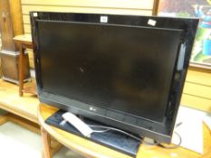 An LG flatscreen TV & control