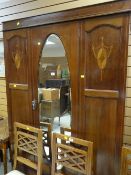 An inlaid mahogany wardrobe with base drawer & oval centre mirror