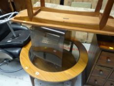 A retro circular Schreiber smoky glass coffee table & a Long John coffee table by Vanson together