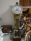 A set of large coin-operated weighing scales