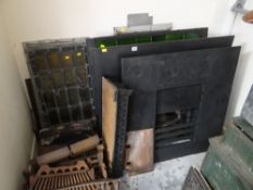 A quantity of architectural salvage items including fireplaces, dog grates & stain glass (removed