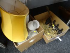 A box of four flat irons, a brass trivet stand & a box of lighting