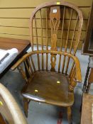 A stained antique Windsor elbow chair