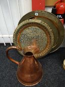 A large copper conical measure jug & two Persian brass trays