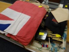 A parcel of military memorabilia including epaulette's, cotton flag & ephemera