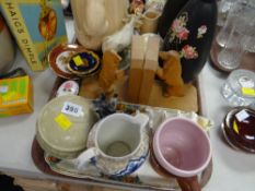 A parcel of mixed pottery ornaments, carved bookends etc