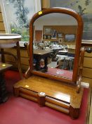 An antique mahogany toilet mirror