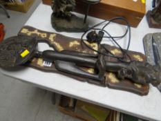 A carved Ghanaian figure & an Eastern inlaid book rest