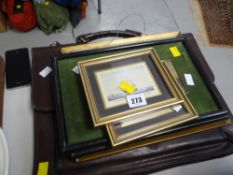 A leather portfolio case & parcel of prints