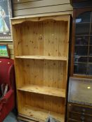 A modern pine adjustable open bookcase