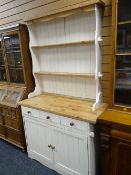 A painted pine compact dresser with three-drawer & two cupboard base