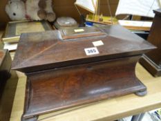An early nineteenth century rosewood sarcophagus tea caddy (distressed)