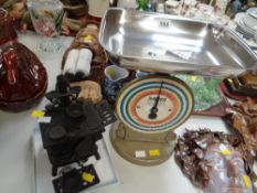 A vintage Salter coin checker & a cast iron model of a range with pans
