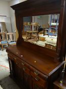 Early twentieth century mirror backed sideboard with six-drawers above a three-cupboard base with