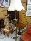 An elaborate tripod brass standard lamp & shade