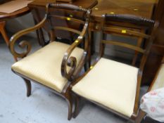 A pair of antique chairs, one with elbow supports