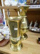 An ecclesiastical brassware ewer with 'IHS' cipher together with a ecclesiastical brassware vase