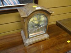 A mantel clock with brass dial (distressed)