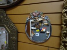 A painted barbola-type bevelled wall mirror