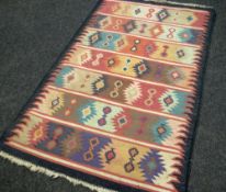 A PINK PATTERNED RUG 183 x 120cms