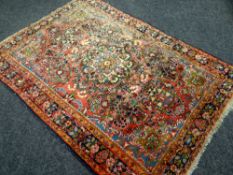 A MULTI-COLOURED PATTERNED RUG 206 x 145cms