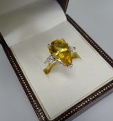 A MODERN YELLOW BERYL & DIAMOND RING both beryl and shoulder diamonds of pear-shape, in 18ct
