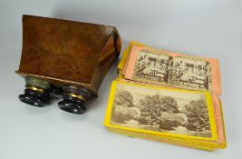 A WALNUT CASED SLIDE-VIEWER & QUANTITY OF SLIDES mainly topographical and historic views of France