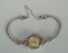 A VINTAGE CYMA PLATINUM & DIAMOND COCKTAIL WATCH working at time of cataloguing process