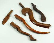 A PARCEL OF FIVE TREEN KNITTING STICKS / TOOLS including a novelty leg and boot knitting stick and a