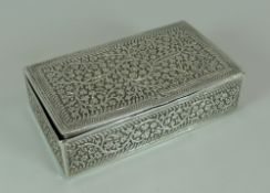 A LATE VICTORIAN SILVER CASKET with all-over floral repousse, import mark for 1894, maker Edwin