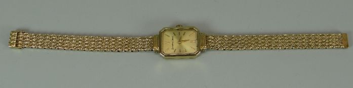 A 9CT YELLOW GOLD BUECHE-GIROD LADIES WRISTWATCH with automatic movement and on conforming