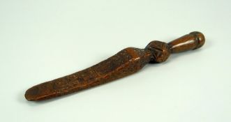 AN EIGHTEENTH CENTURY TREEN CARVED KNITTING SHEATH with all over primitive geometric decoration