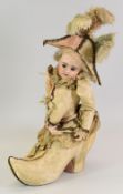 A RARE & VERY UNUSUAL ETIENNER DENAMUR DOLL CHOCOLATE BOX, circa 1860, the doll part protruding from