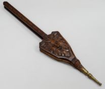 A PAIR OF VICTORIAN LONG HANDLED OAK BELLOWS having brass nozzle & heavily carved including 'Green-