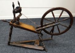 AN EARLY NINETEENTH CENTURY WELSH OAK SPINNING WHEEL