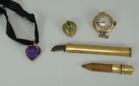 AN UNUSUAL 9CT YELLOW GOLD ENCASED PENCIL & SCALPEL / SHARPENER, a yellow gold (believed) heart-