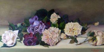 L DEAKIN oil on canvas - still life of cut roses, signed and dated 1902, 25 x 49cms