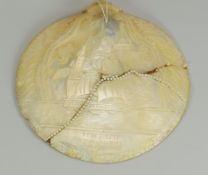 AN INTERESTING MOTHER-OF-PEARL SHELL CARVING featuring a sailing ship and foliage, inscribed HMS