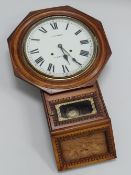 A DROP-DIAL WALL CLOCK IN MARQUETRY CASE having a white enamel dial bearing Roman numerals and 'S.H.